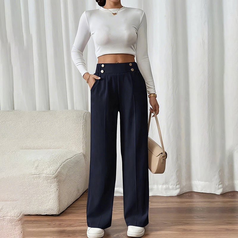 Woman wearing women's wide leg business trousers in navy with high waist and button details